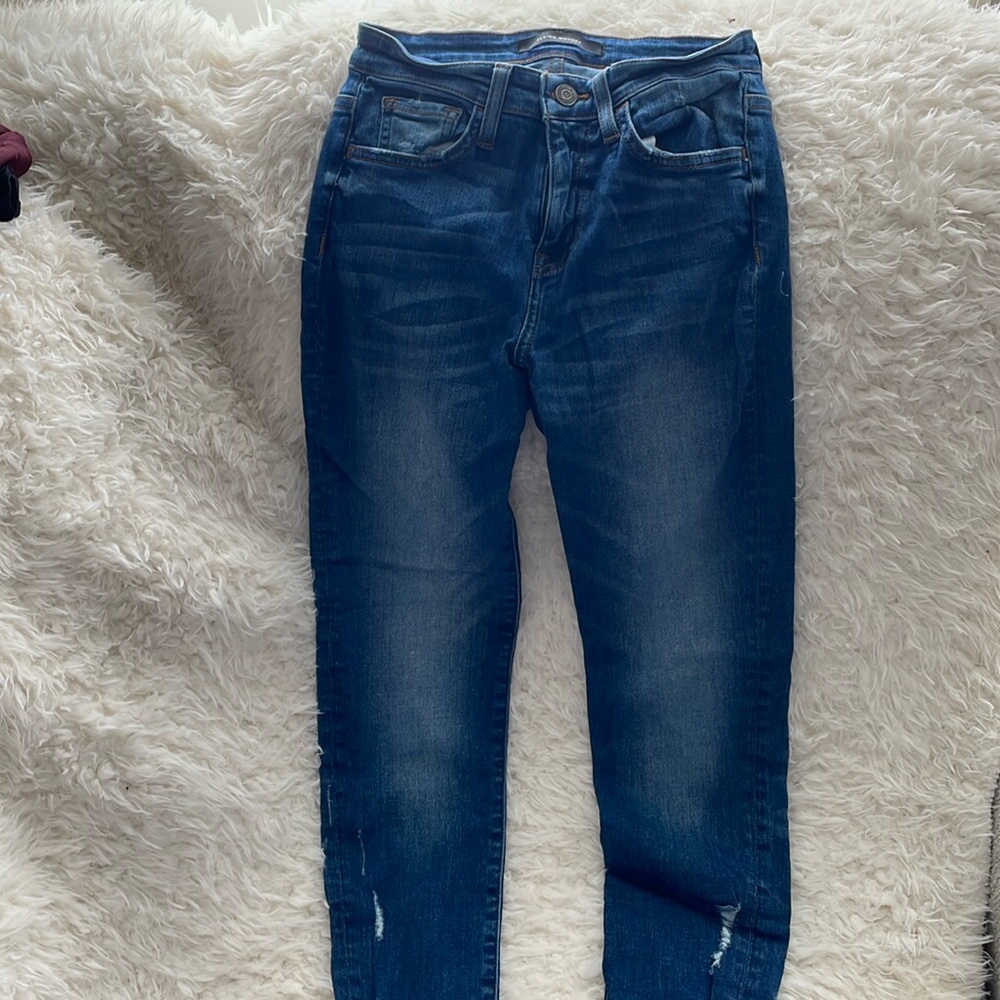 Distressed and faded flying monkey jeans